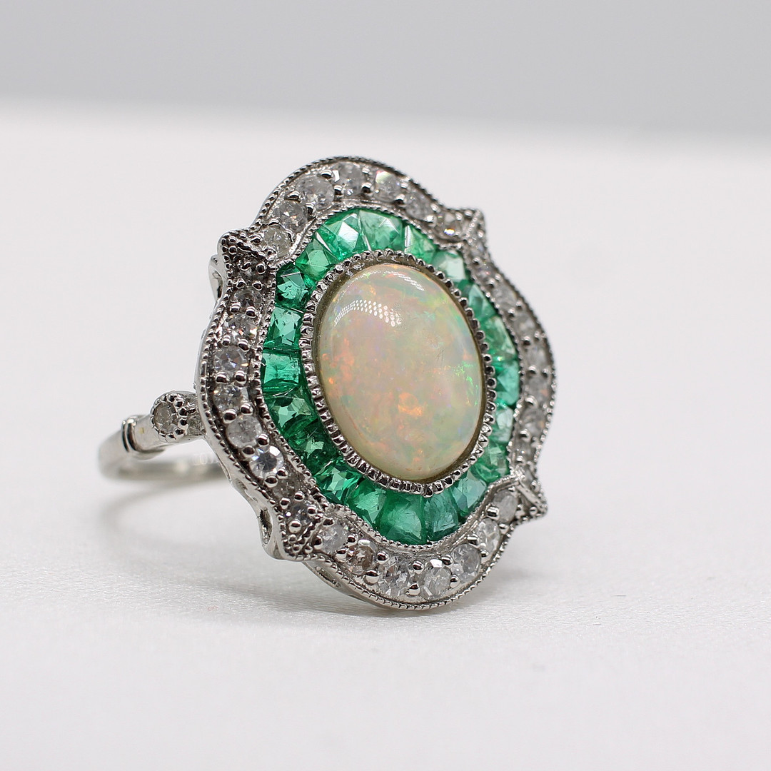EMERALD, DIAMOND & OPAL RING.