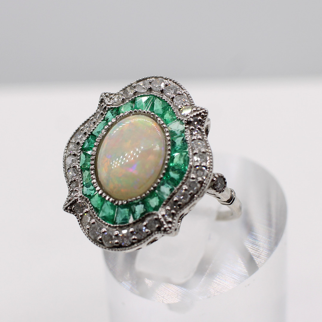 EMERALD, DIAMOND & OPAL RING.