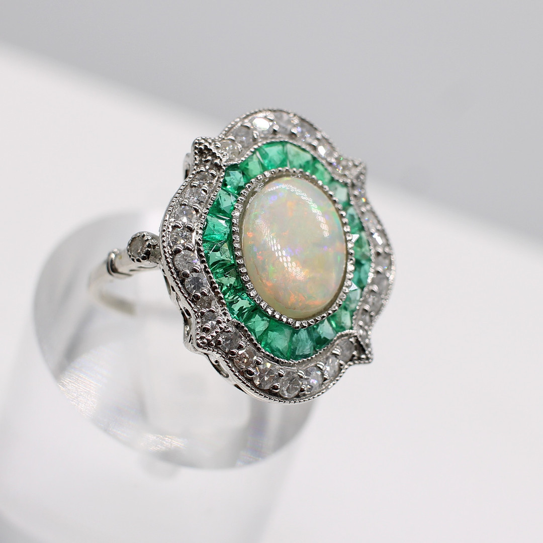 EMERALD, DIAMOND & OPAL RING.