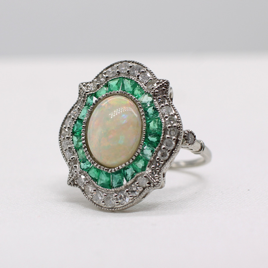 EMERALD, DIAMOND & OPAL RING.