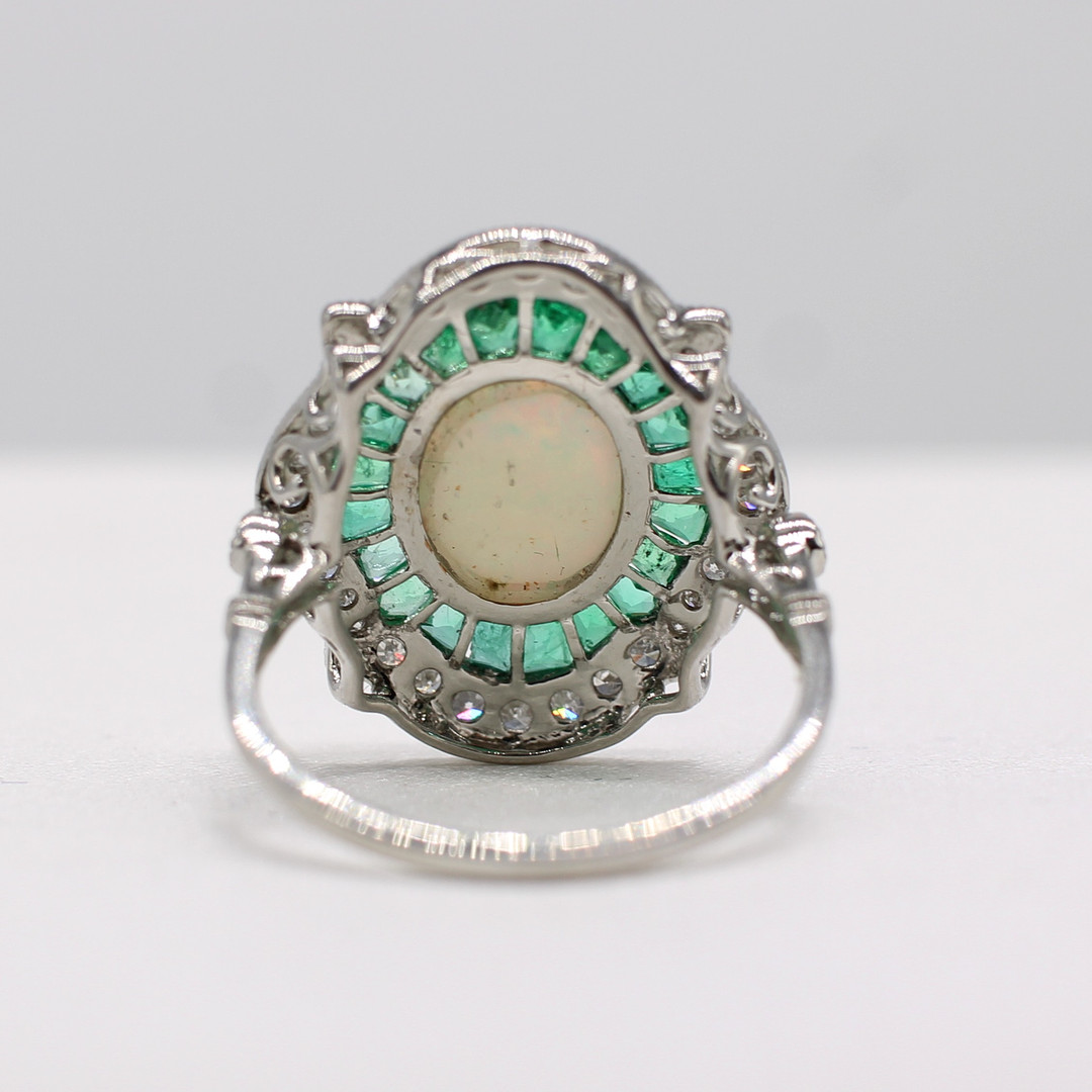 EMERALD, DIAMOND & OPAL RING.
