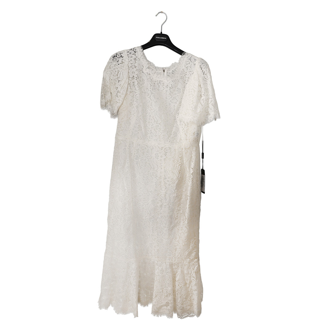 A DOLCE & GABBANA WHITE LACE DRESS.