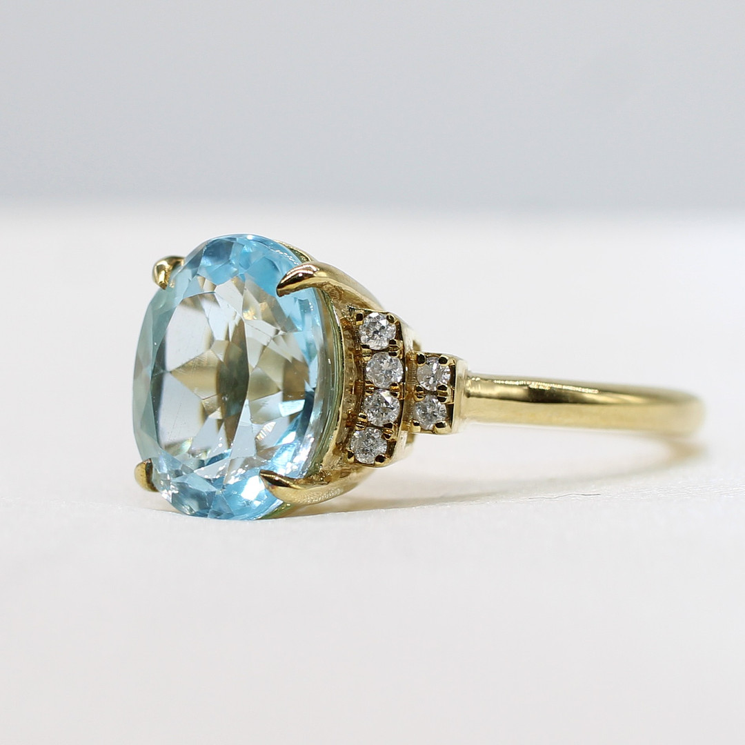 BLUE TOPAZ & DIAMOND RING.