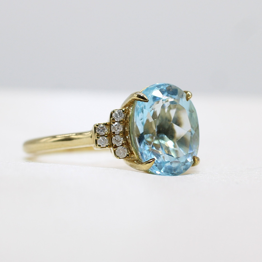 BLUE TOPAZ & DIAMOND RING.