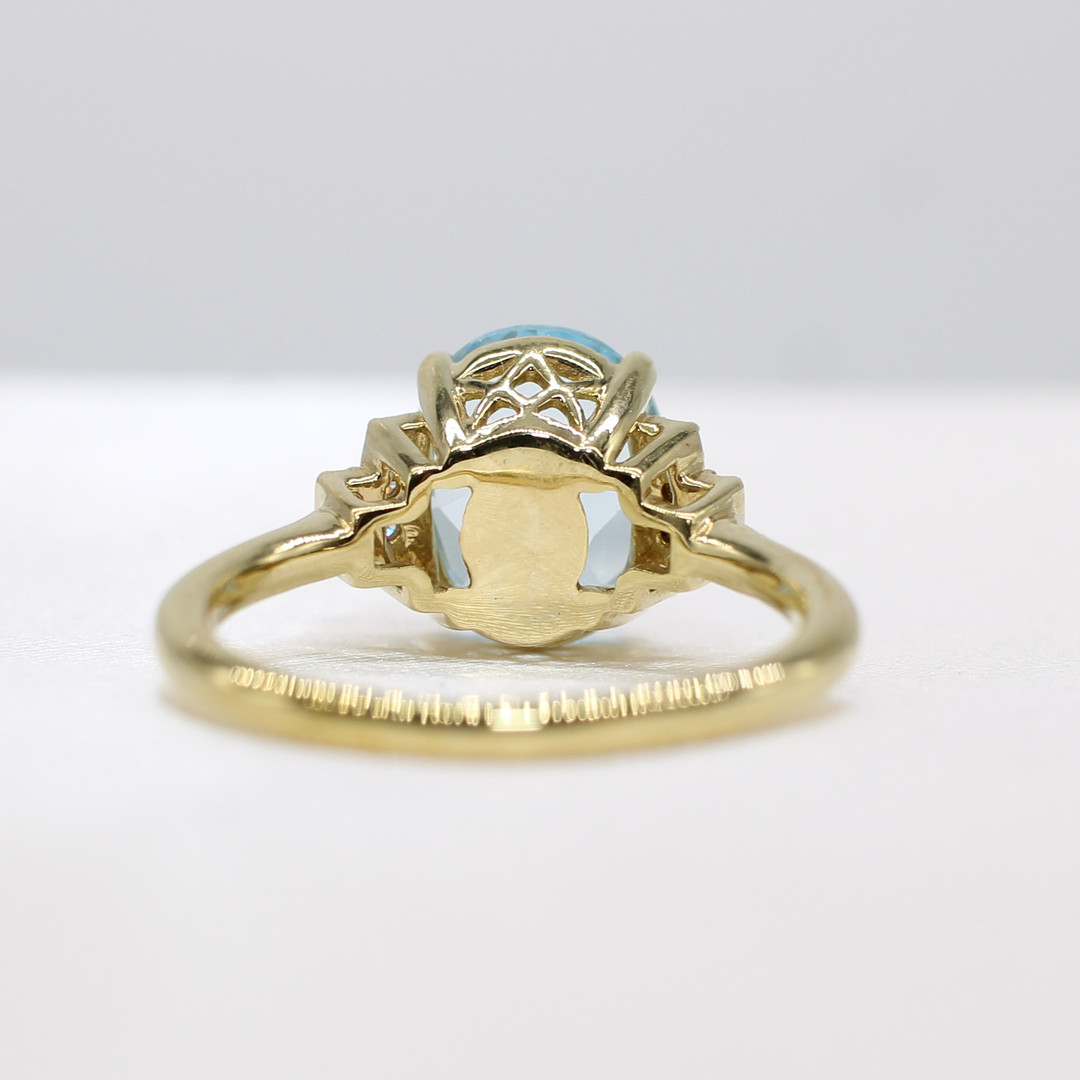 BLUE TOPAZ & DIAMOND RING.