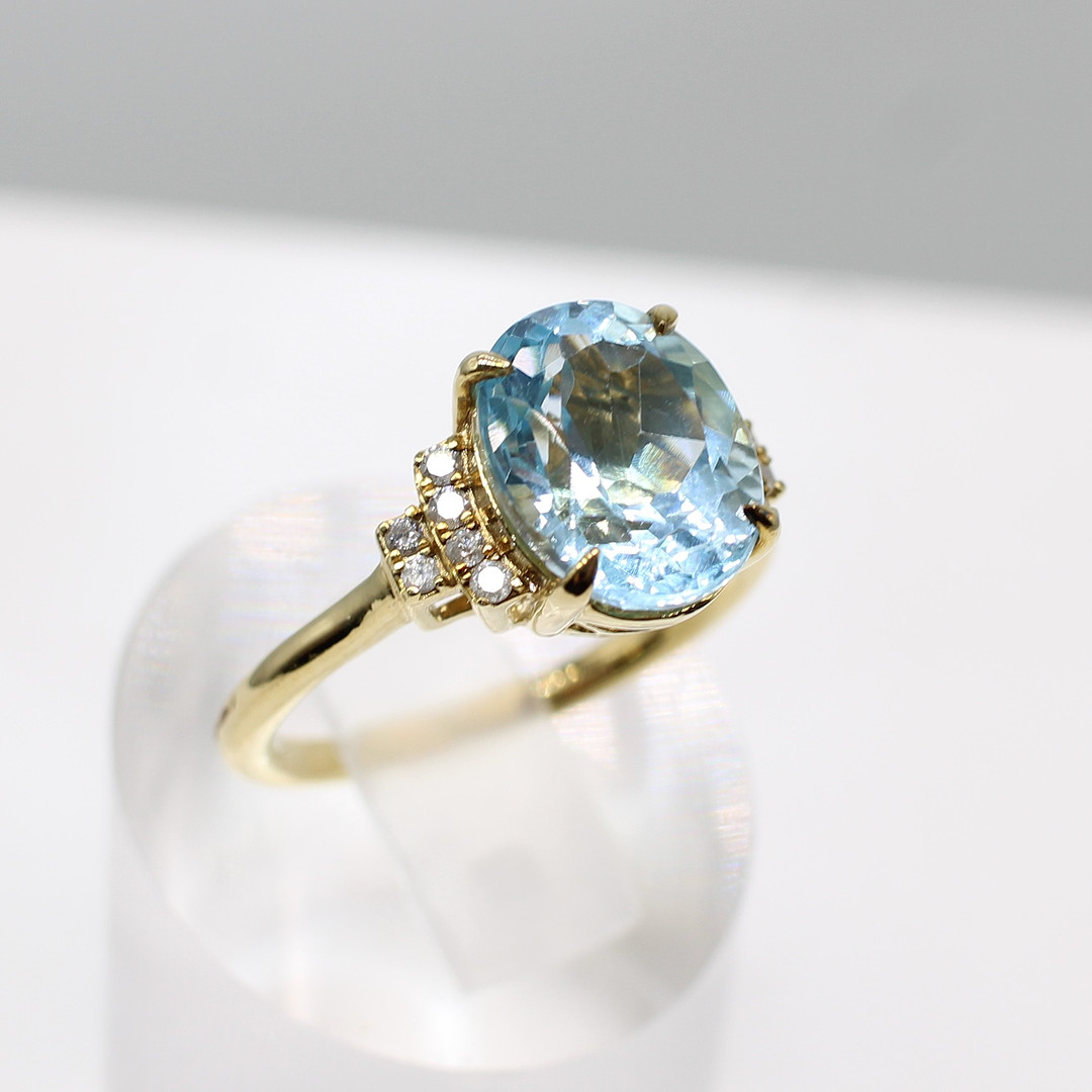 BLUE TOPAZ & DIAMOND RING.