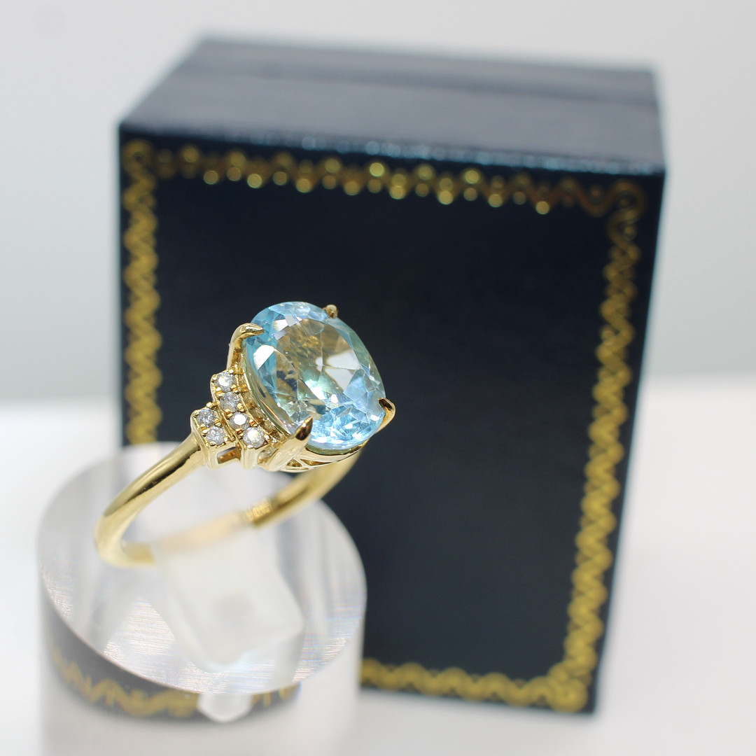 BLUE TOPAZ & DIAMOND RING.