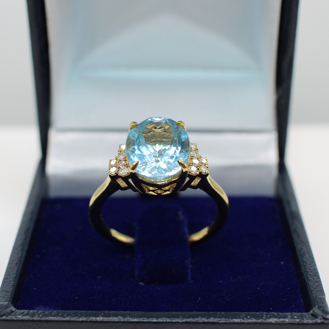 BLUE TOPAZ & DIAMOND RING.