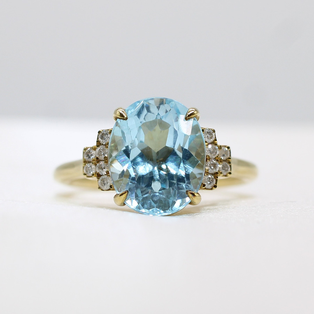 BLUE TOPAZ & DIAMOND RING.