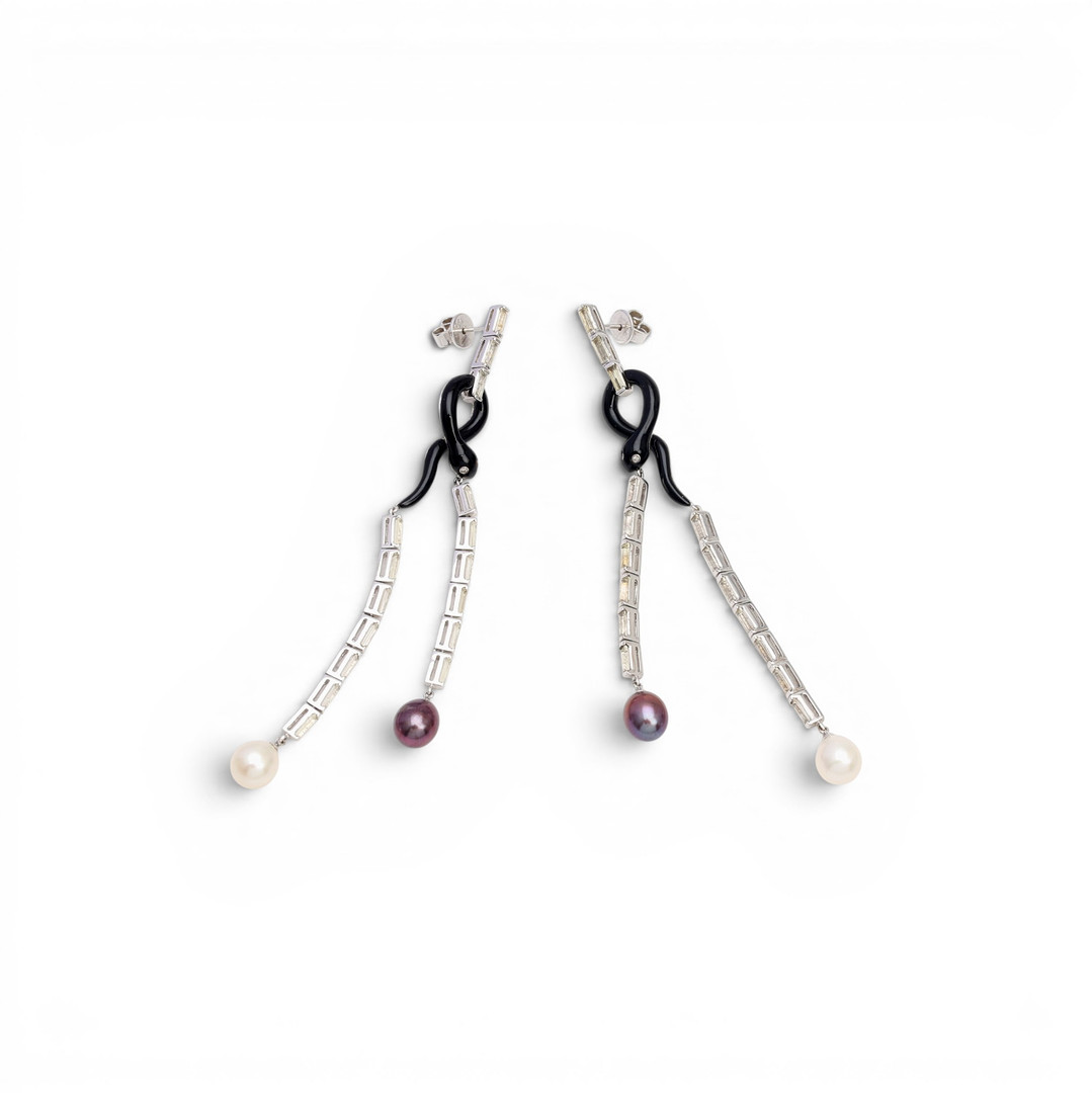 Snake-shaped long earrings with enamel and gemstones.