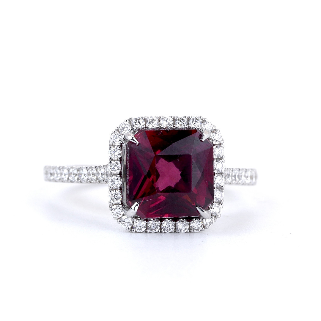 18CT WHITE GOLD SPINEL & DIAMOND SET RING.
