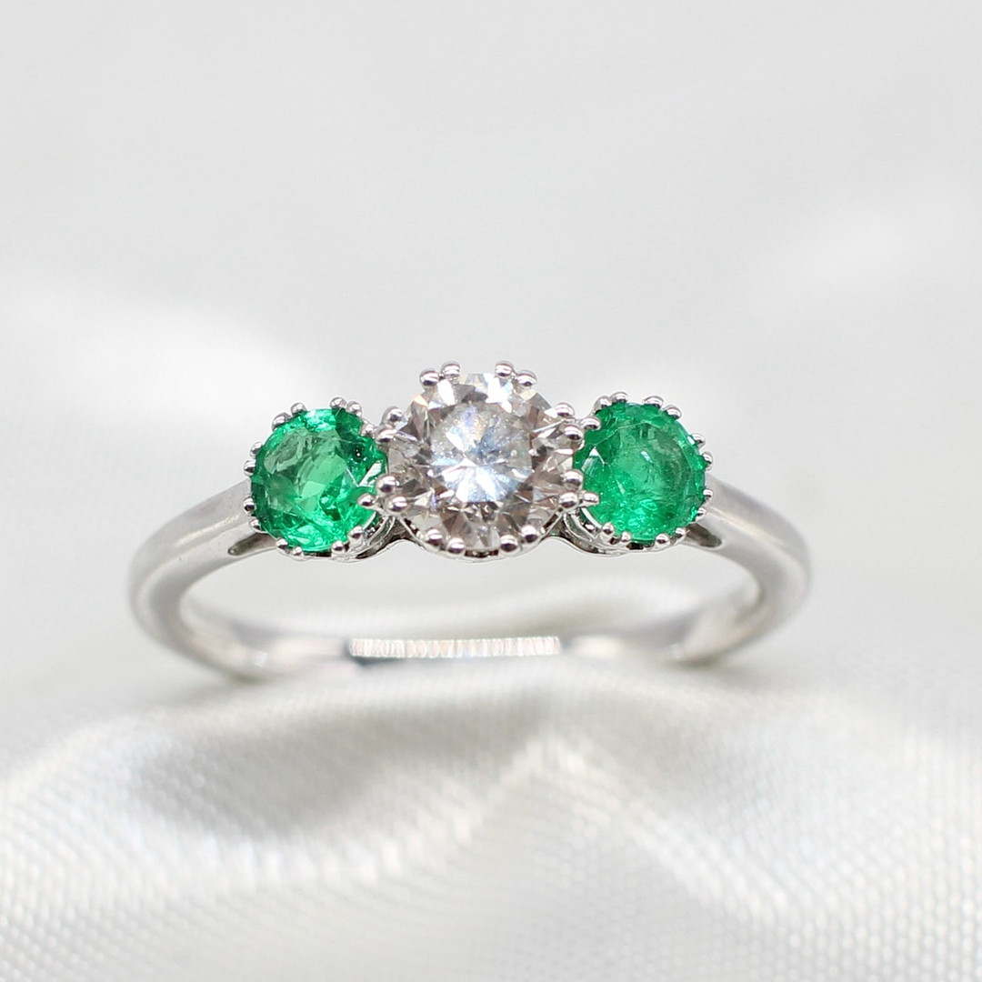 EMERALD & DIAMOND TRILOGY RING.