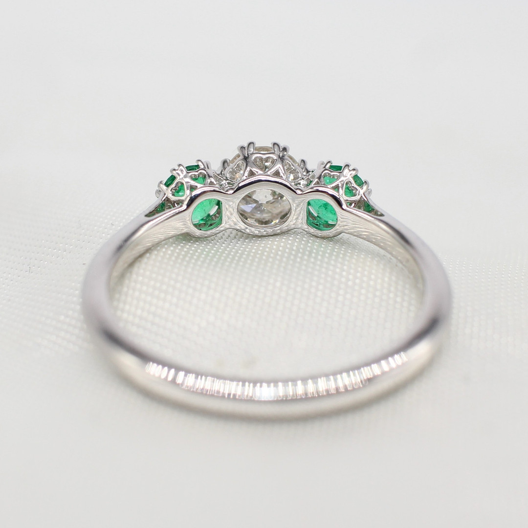 EMERALD & DIAMOND TRILOGY RING.