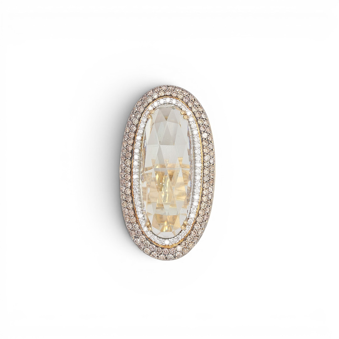 Large quartz ring bordered with diamonds.