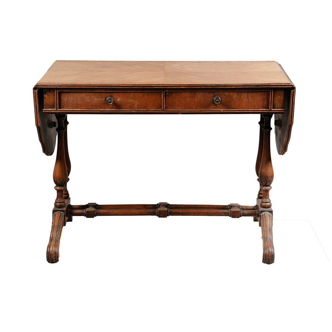 A REGENCY-STYLE QUARTER VENEERED AND CROSS-BANDED SOFA TABLE.
