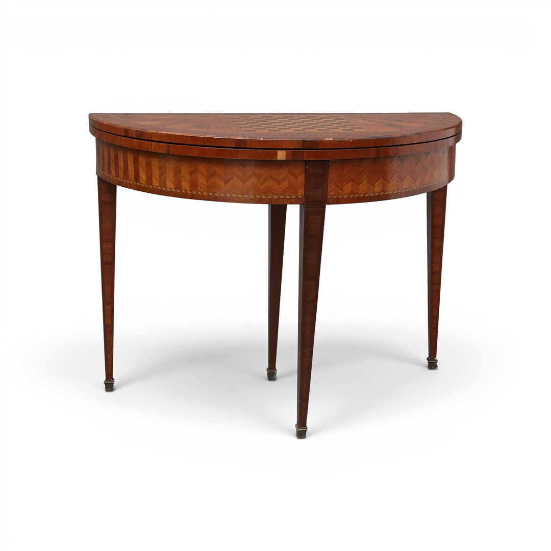 Louis XVI-style half-moon gaming table in rosewood with fine wood marquetry, late 19th Century.