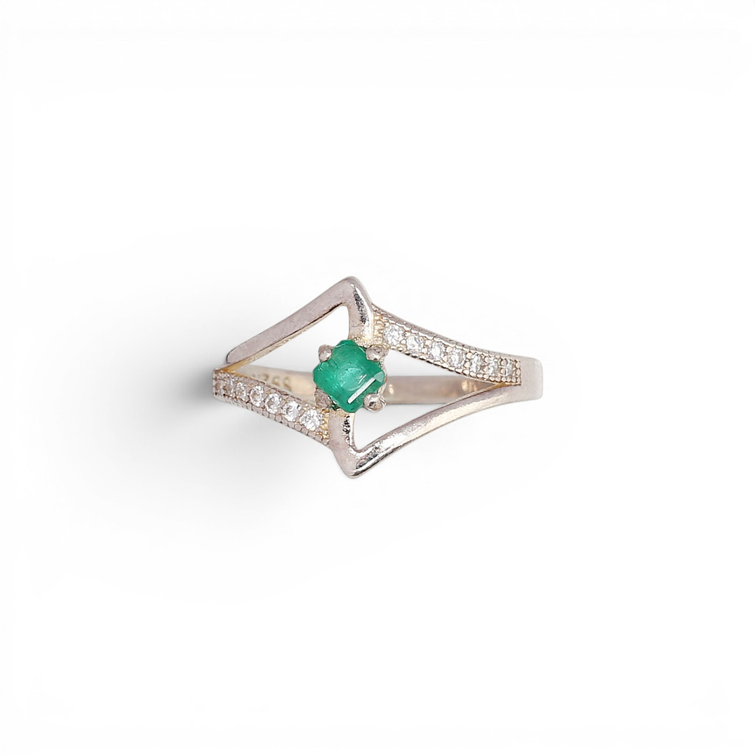 Emerald and zircons ring.