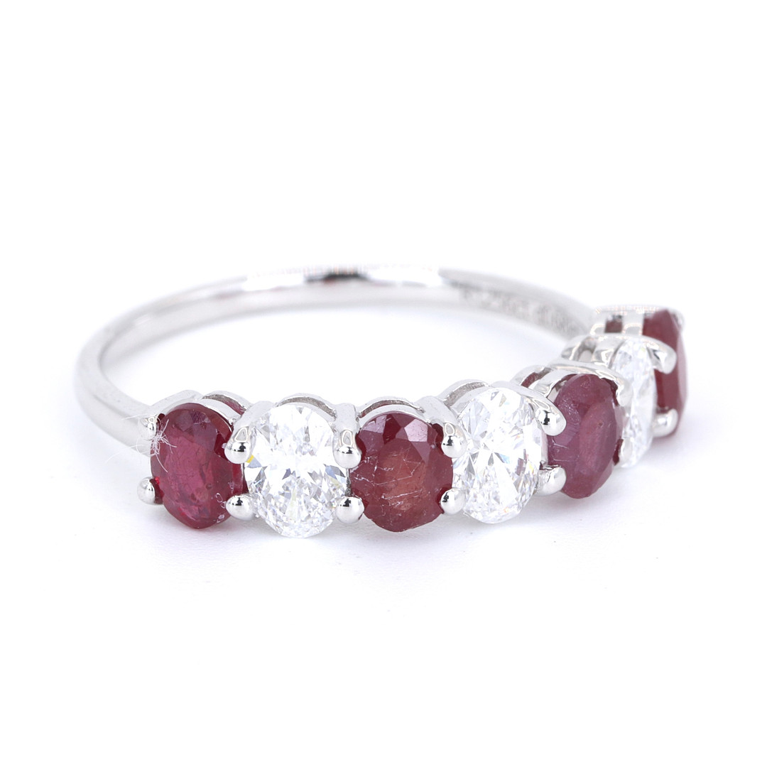 9CT RUBY AND DIAMOND HALF ETERNITY RING.