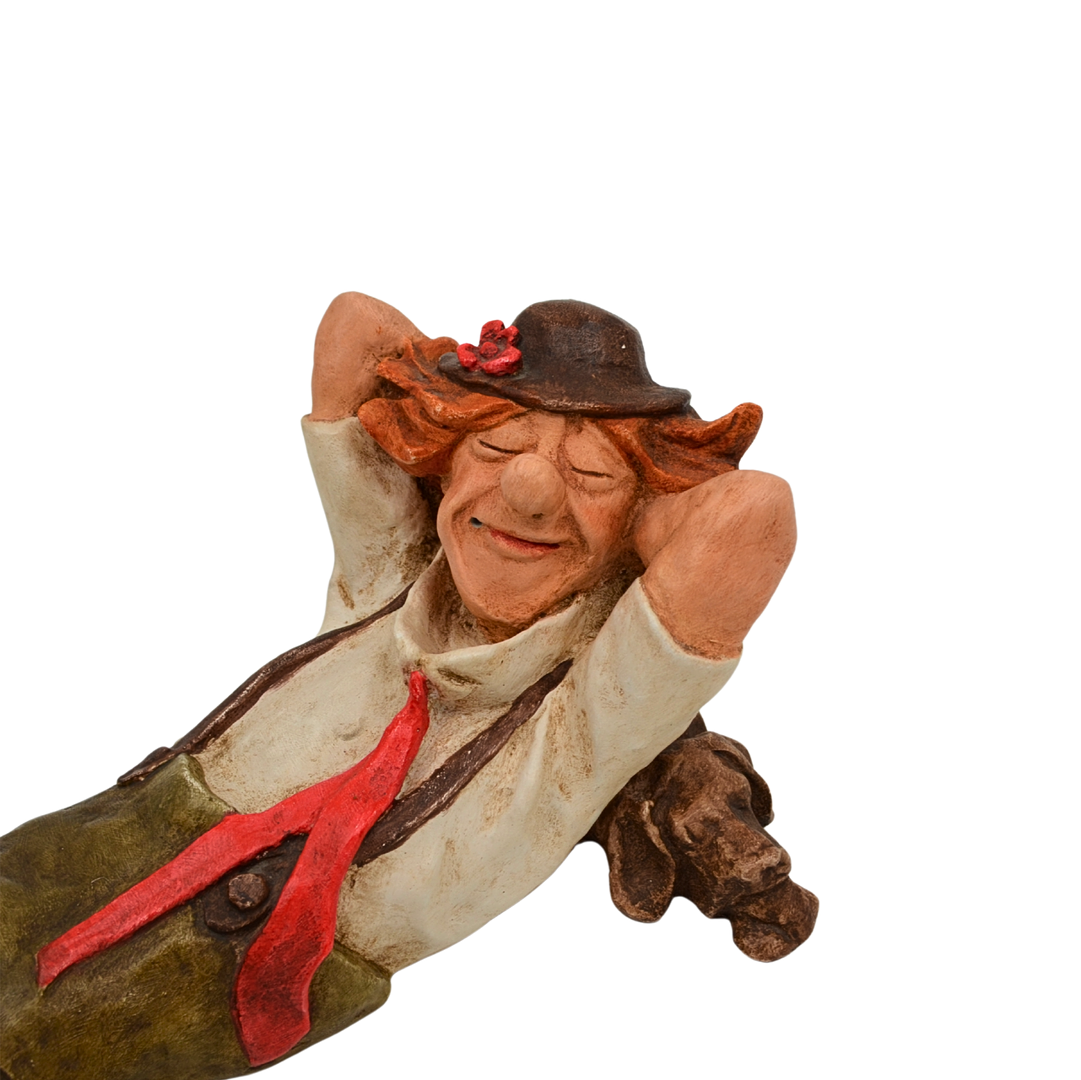 Dekorationsfigur – Liegender Clown mit Hund.