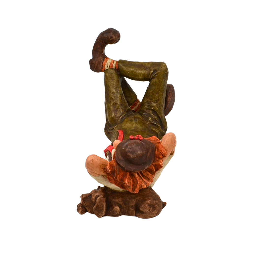 Dekorationsfigur – Liegender Clown mit Hund.