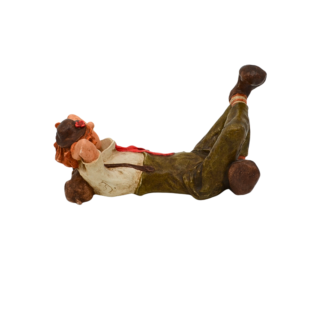 Dekorationsfigur – Liegender Clown mit Hund.