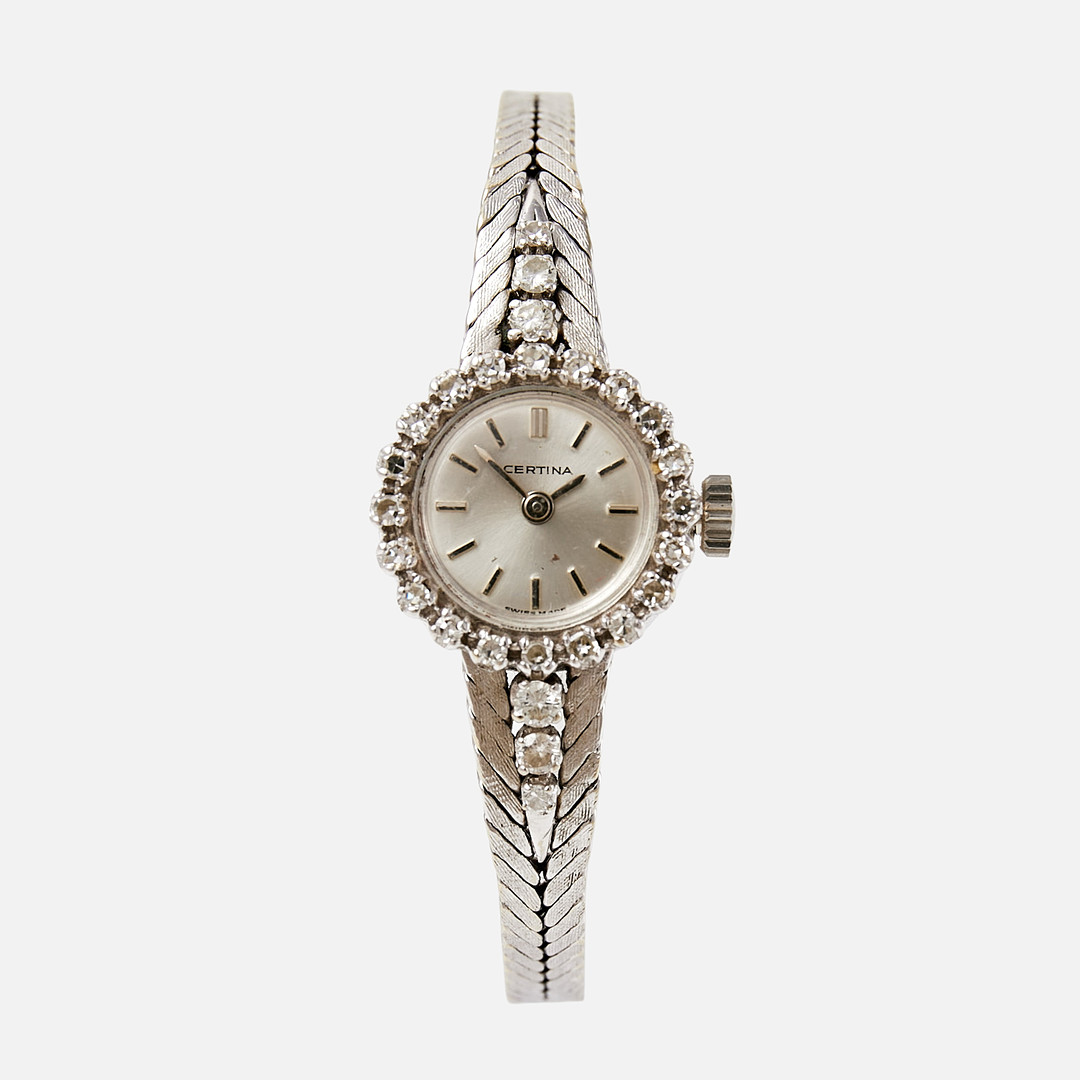 CERTINA (Swiss Made), boett och integrerad länk i 18 k guld med briljantslipade resp. åttkantslipade diamanter, totalt ca 0,57 ct, 17,5 mm, ca 1960-tal.