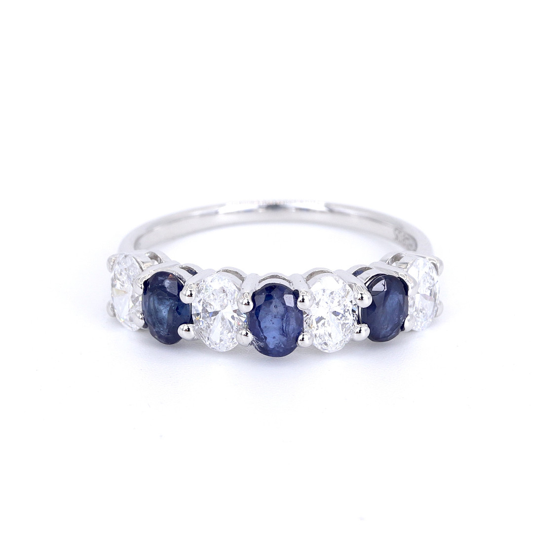 9CT SAPPHIRE AND DIAMOND HALF ETERNITY RING.