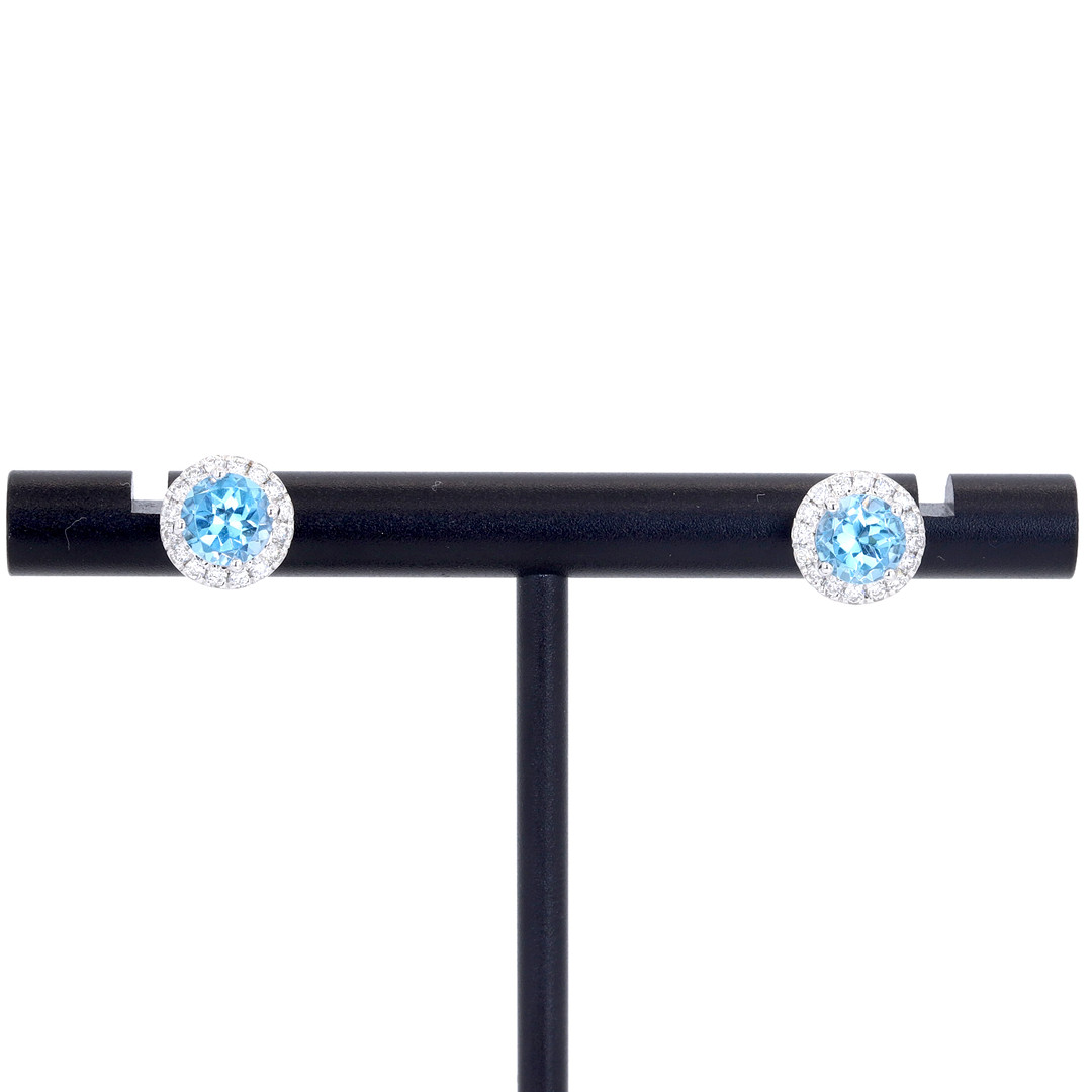 9CT TOPAZ AND DIAMOND CLUSTER EARRINGS.