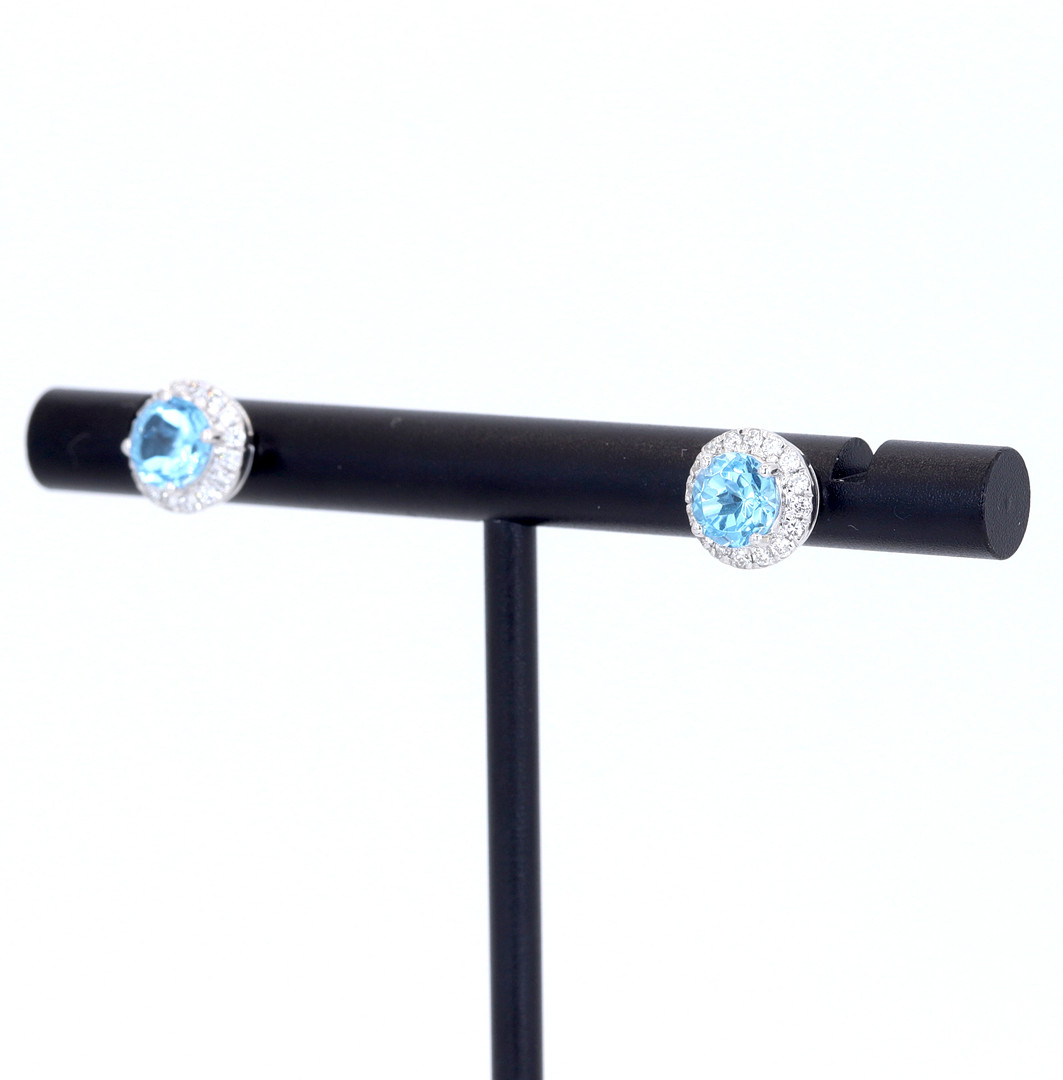 9CT TOPAZ AND DIAMOND CLUSTER EARRINGS.