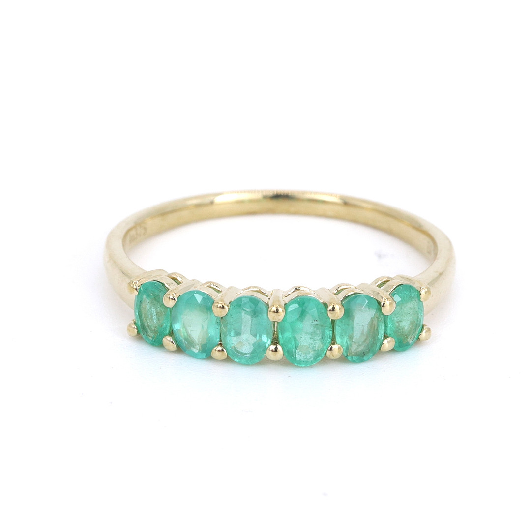 EMERALD 9CT HALF ETERNITY RING.