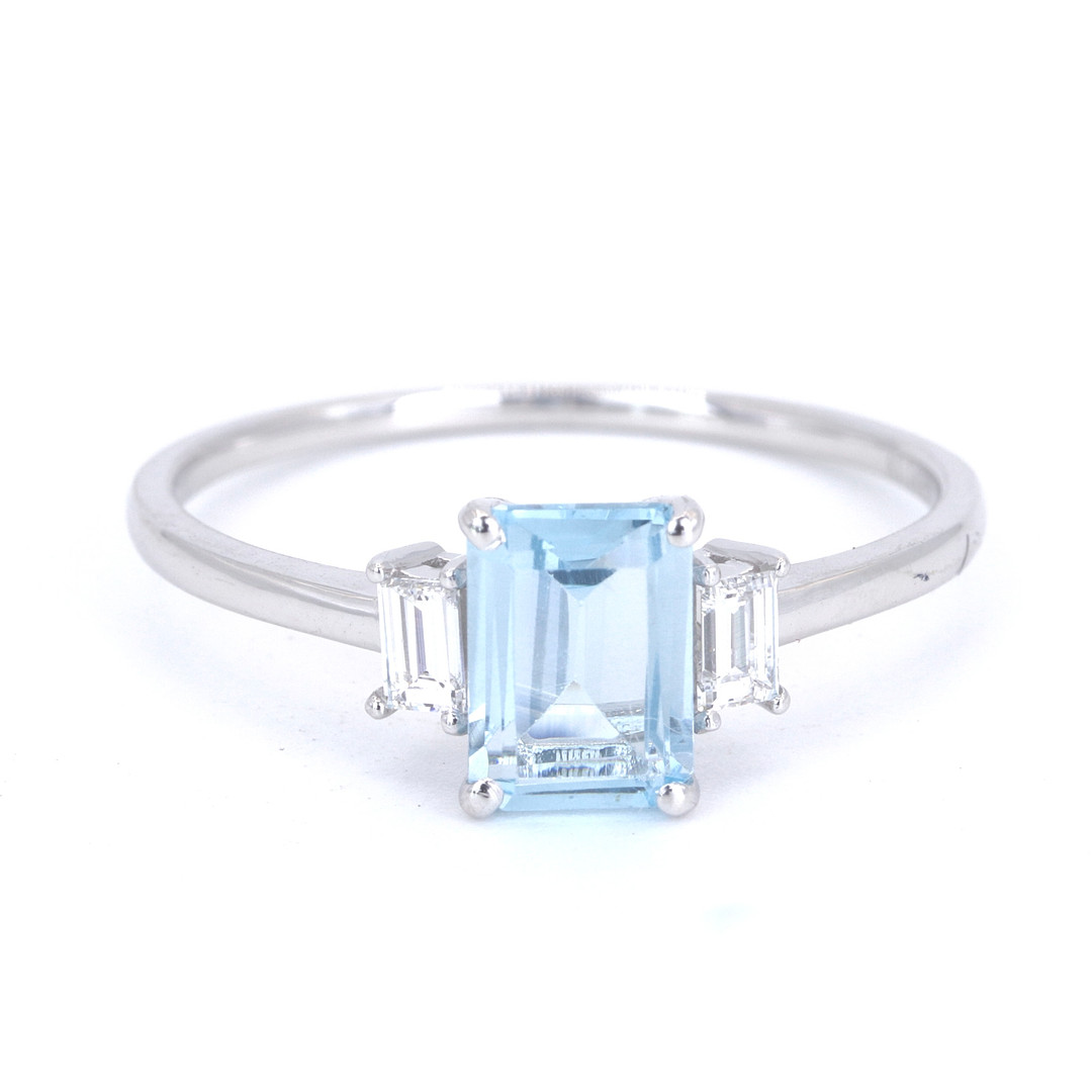 BLUE TOPAZ AND DIAMOND RING.