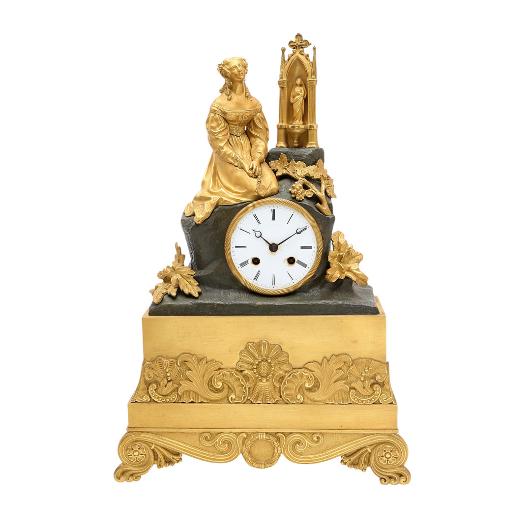 Reloj de sobremesa Restauración en bronce dorado y pavonado, hacia del 1830.