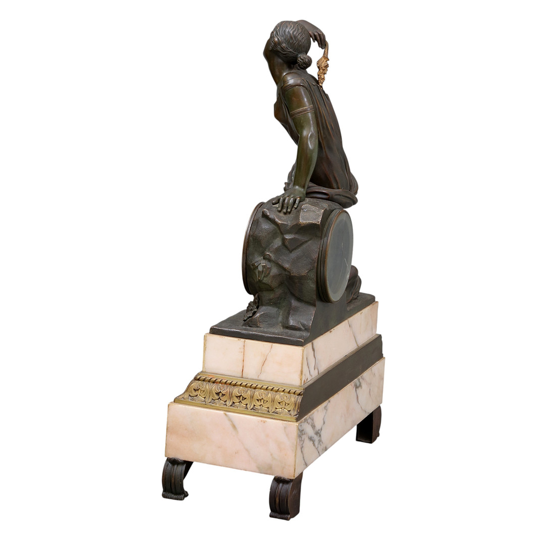Louis Philippe table clock in patinated bronze and marble, 19th Century.