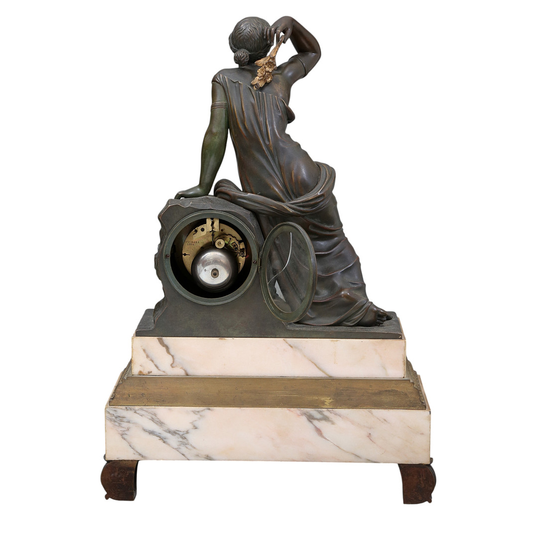 Louis Philippe table clock in patinated bronze and marble, 19th Century.