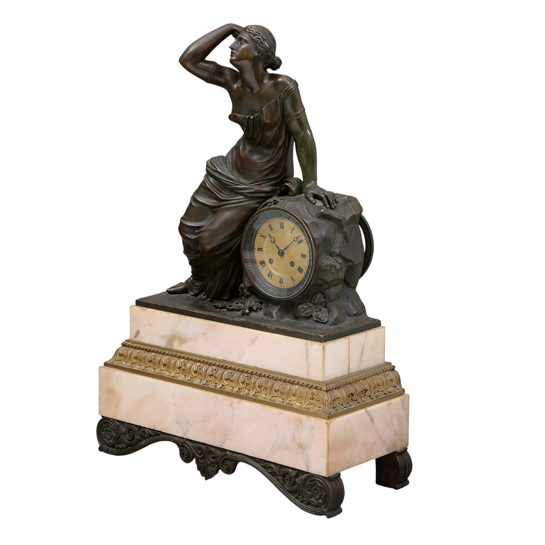 Louis Philippe table clock in patinated bronze and marble, 19th Century.