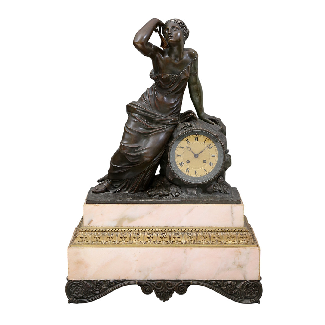 Louis Philippe table clock in patinated bronze and marble, 19th Century.