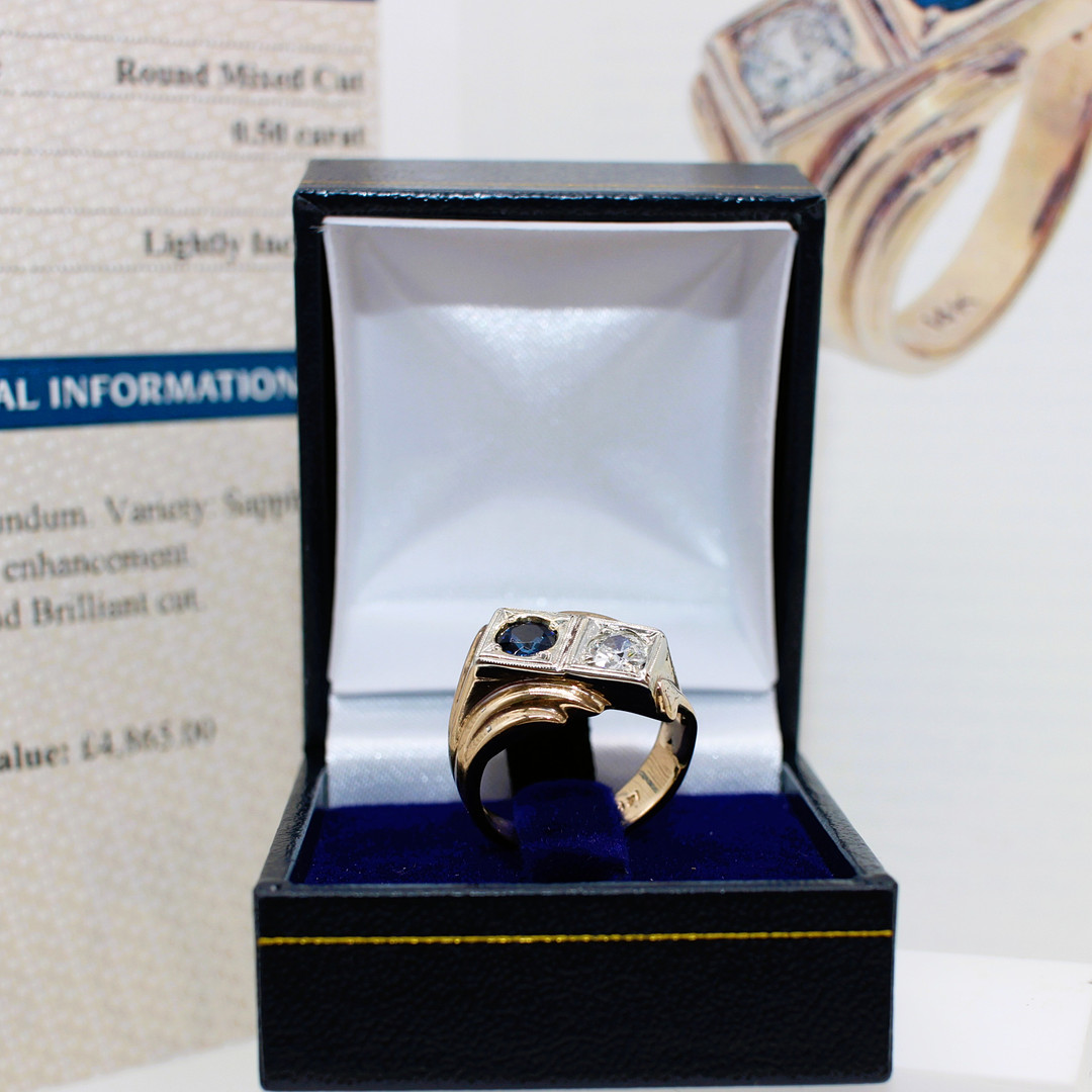 UNUSUAL CERTIFIED SAPPHIRE & DIAMOND RING.
