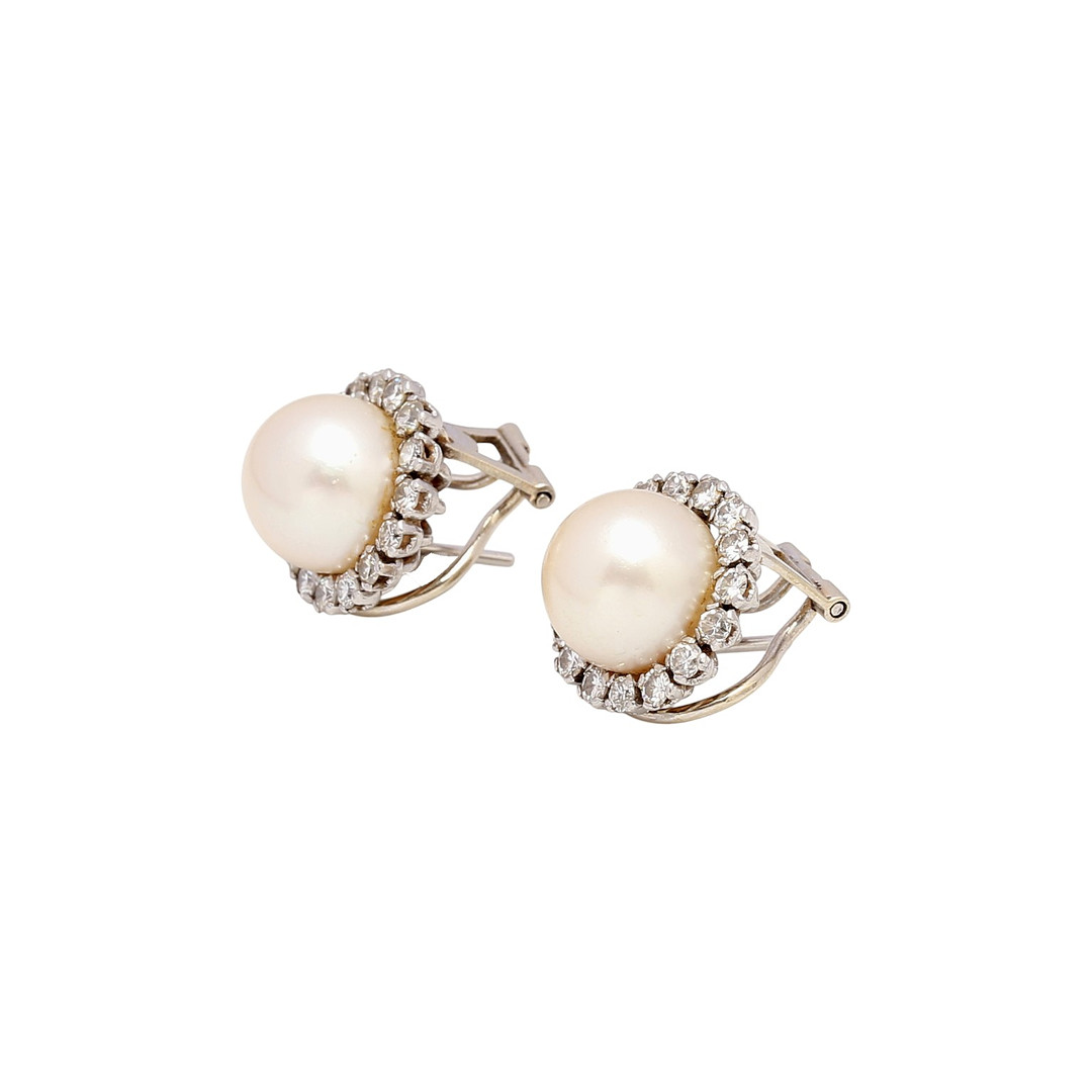 Pearls and diamonds rosette earrings, mid 20th Century.