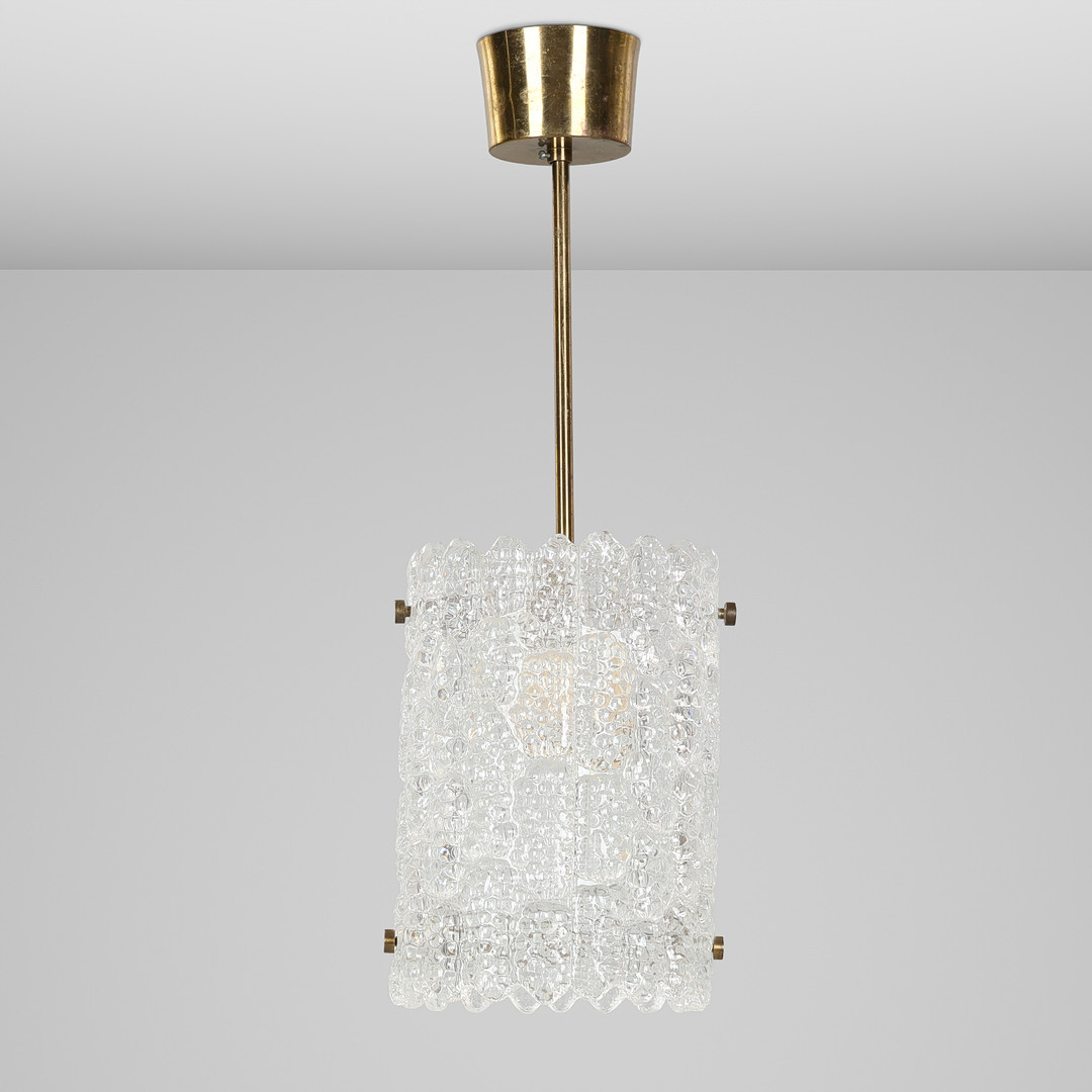 CARL FAGERLUND. Loftslampe af presset glas og messing. Orrefors. Sverige.