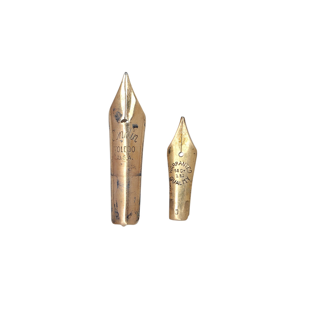 Two 14K gold fountain pen nibs.