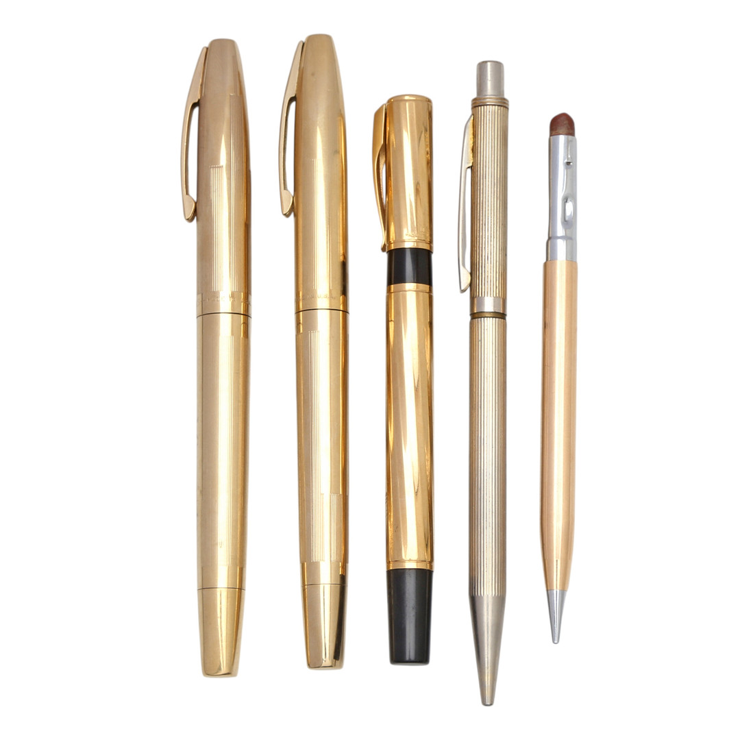 Two fountain pens, two ballpoint pens and a mechanical pencil.