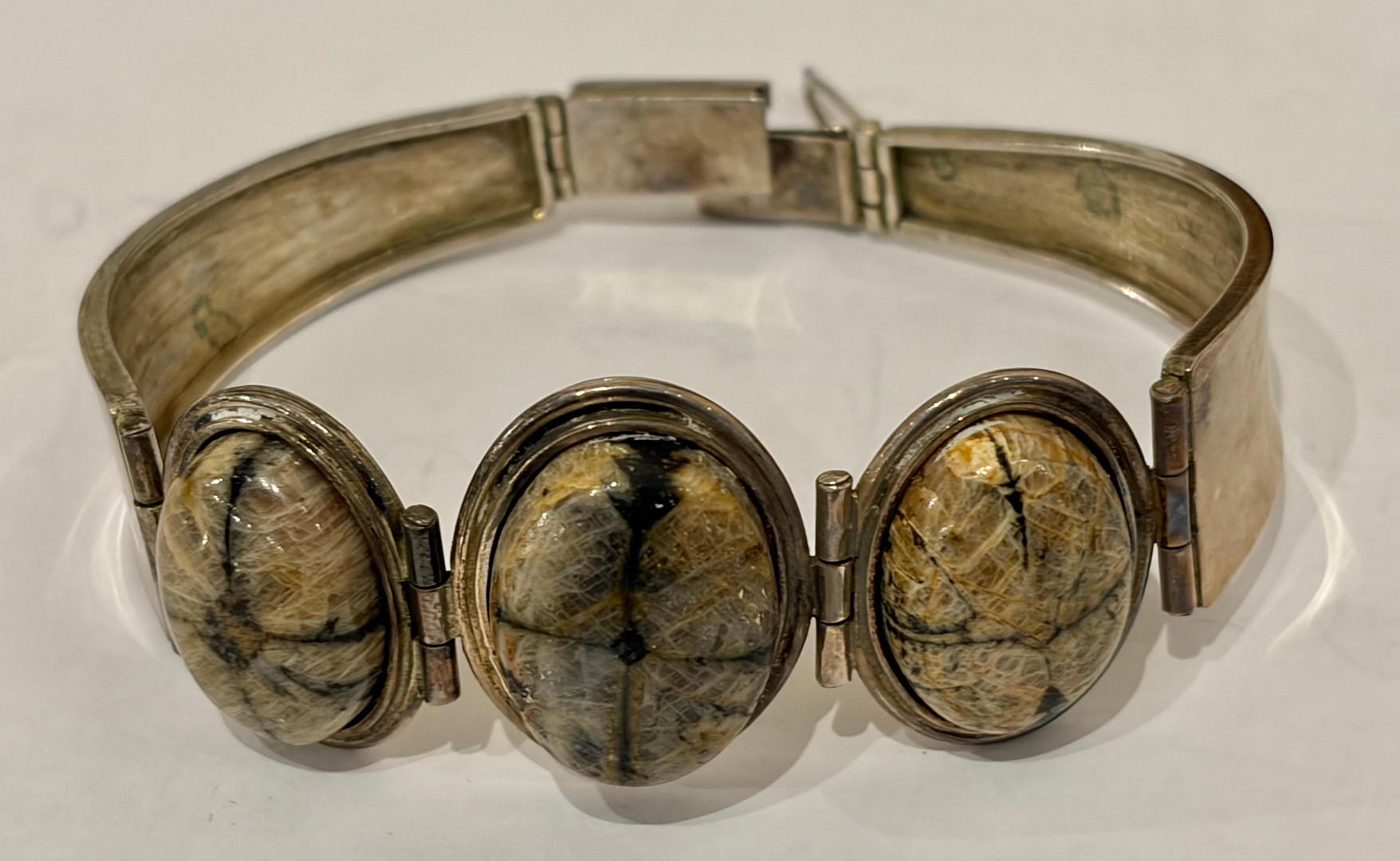 Silver and chiastolite bracelet, circa 1960.