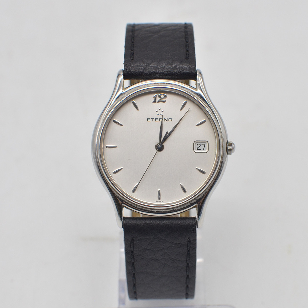ETERNA, QUARZ, ARMBANDUHR, MODELL 2186.41 MIT SILBERNEM ZIFFERBLATT, DAYDATE-ANZEIGE, SPÄTES 20. JAHRHUNDERT.