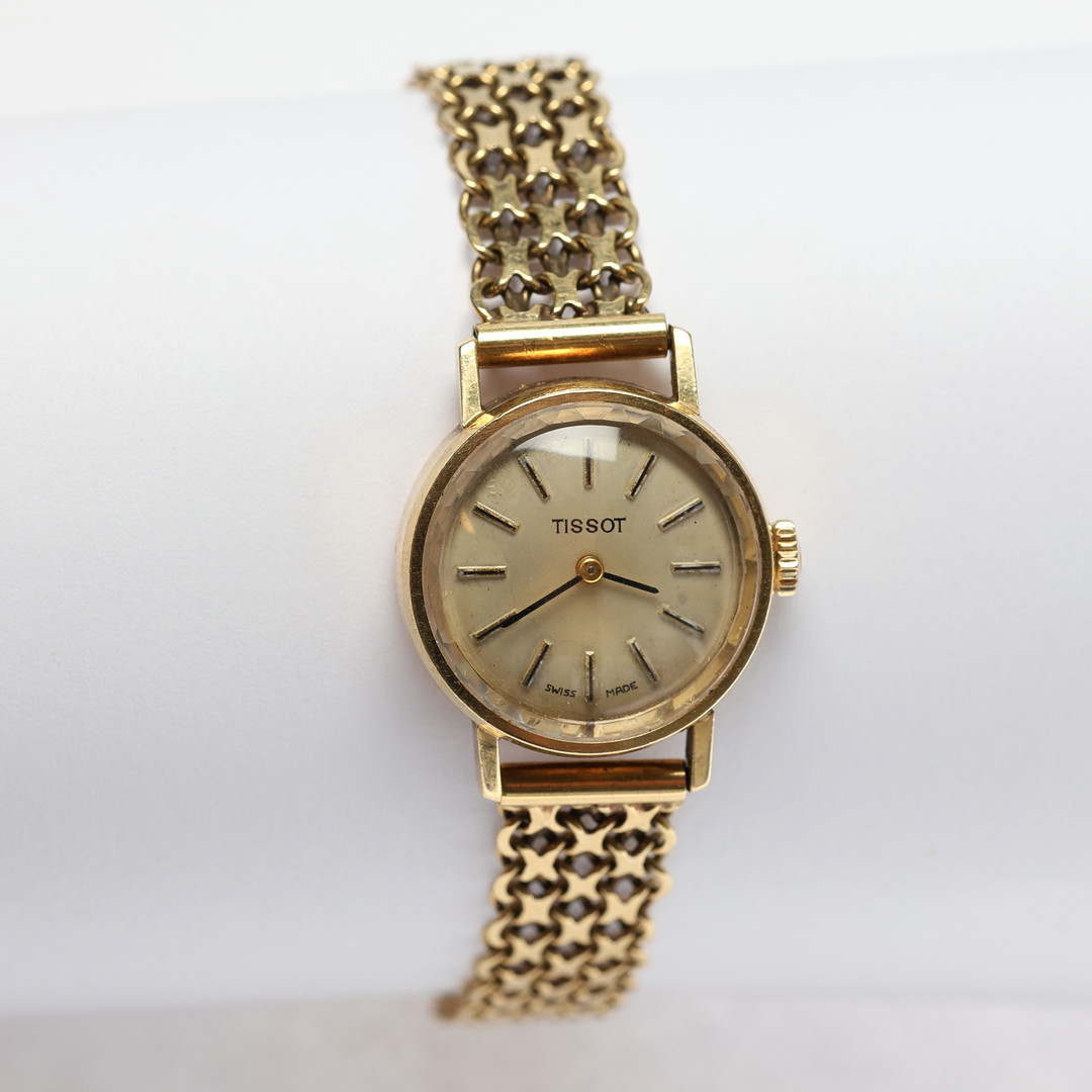 DAMARMBANDSUR, mekanisk, boett och armband i 18k guld 27gram, Tissot.