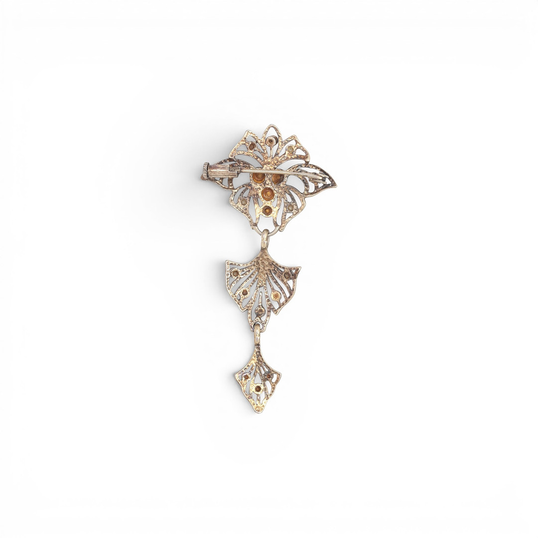 Articulated silver brooch, Modernist style.