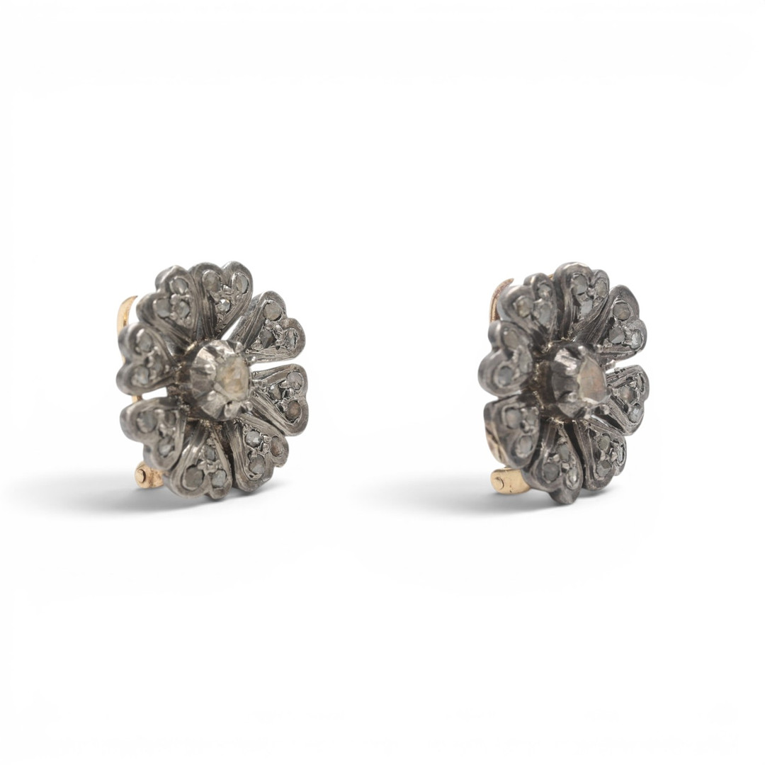 Pair of diamonds floral clip-brooches, late 19th Century.