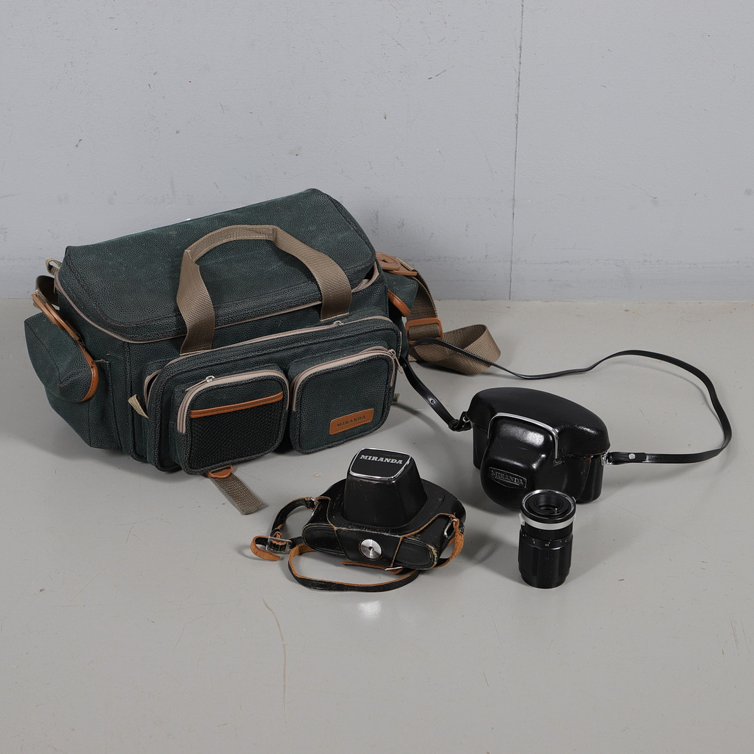 TWO MIRANDA SLR CAMERAS WITH A THIRD LENS.