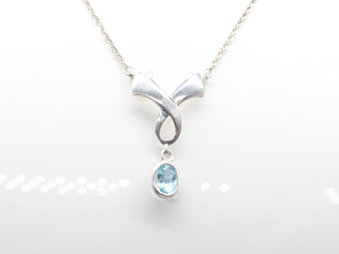 SILVER & BLUE STONE NECKLACE.