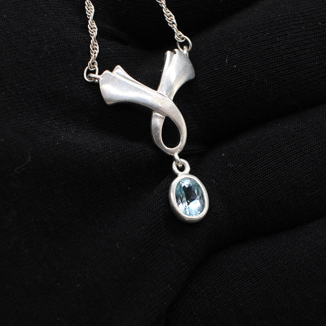 SILVER & BLUE STONE NECKLACE.
