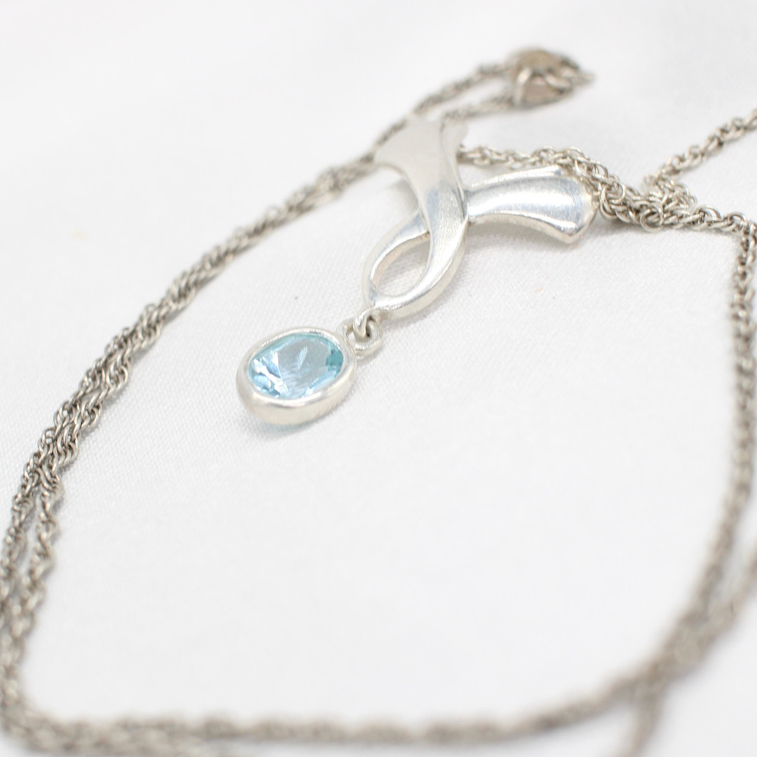 SILVER & BLUE STONE NECKLACE.